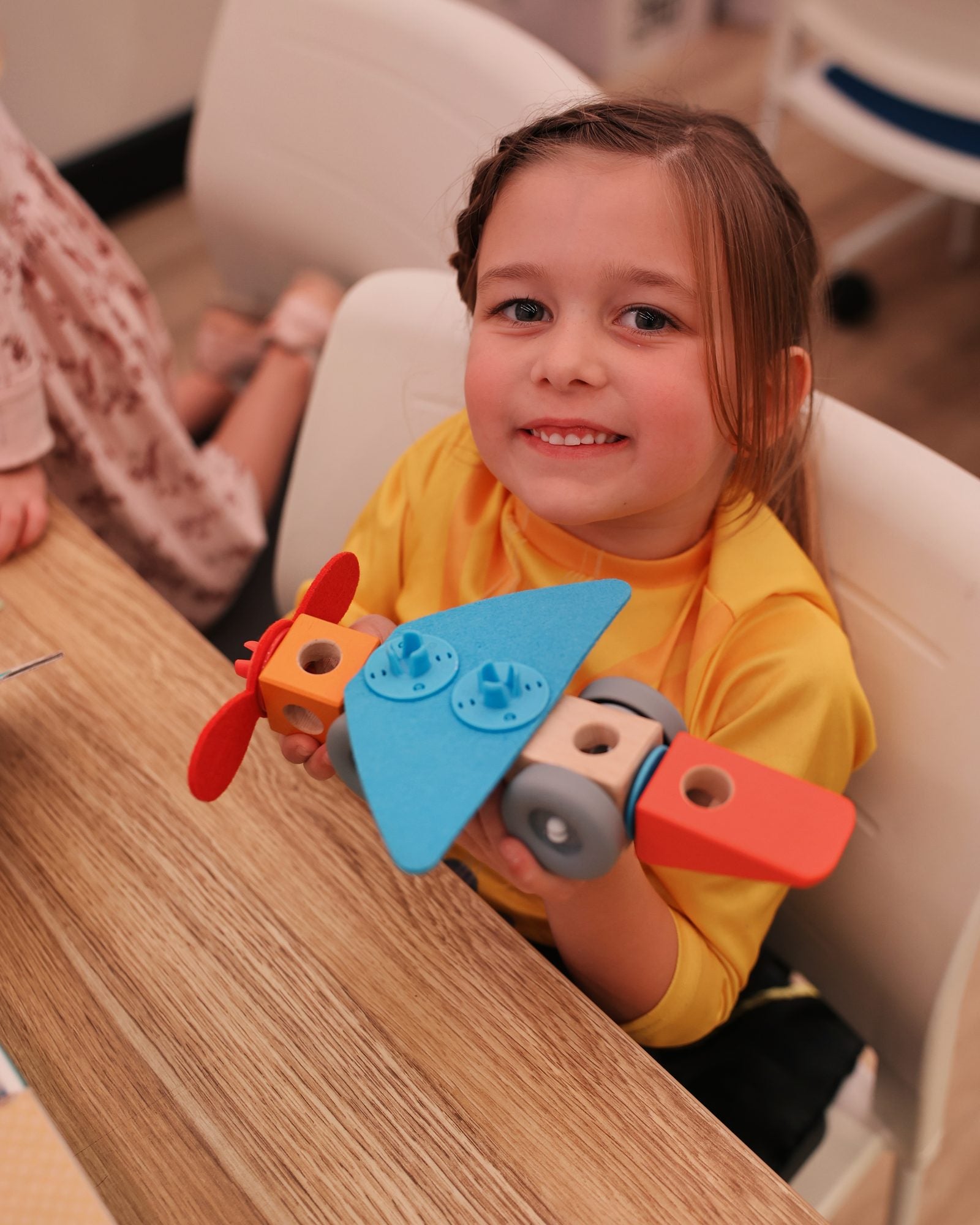A child building at the Wonderloft play table